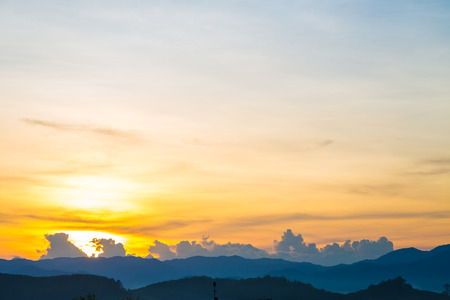 Silhouette mountain sunrise with colorful sky cloud nature viewの写真素材