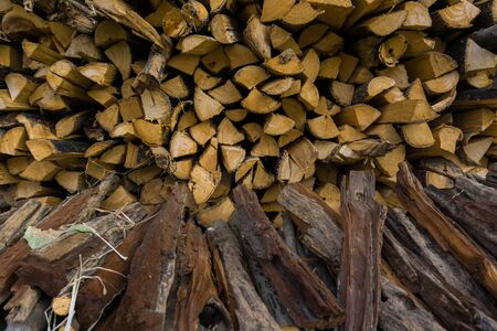 Pile of wood satcked industrial, fire wood patternの写真素材