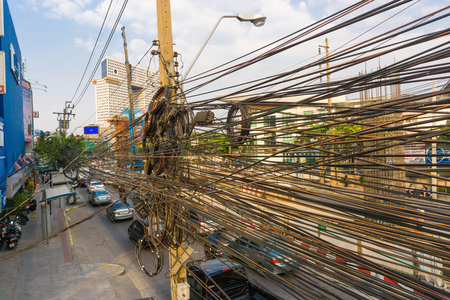 Electrical and network phone line on pole in city infrastructure objectの写真素材