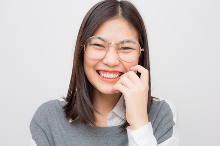 Portrait of asian smiling beautiful women on white backgroundの写真素材