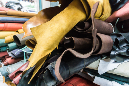 Raw cow vegetable tanned leather sheet crafts in shop, Craftsmanship object