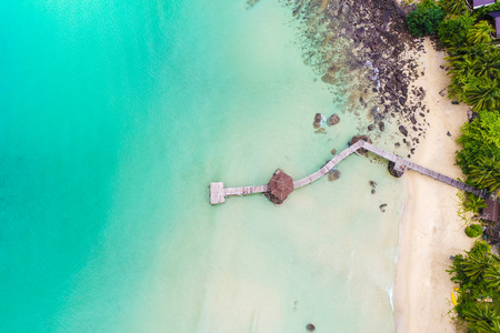 Tropical white sand bech with coconut palm tree background idyllic turquoise sea aerial viewの写真素材