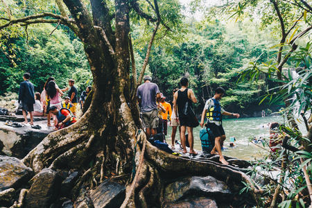 Trad, Thailand - April 29, 2018: Tourist enjoying in Klong Chao water fall tropical forestのeditorial素材