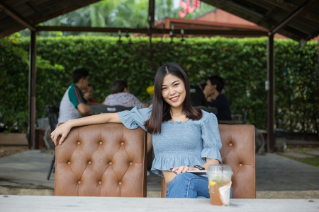 Beautyful asian women sitting in art cafe with drink, Business womenの写真素材
