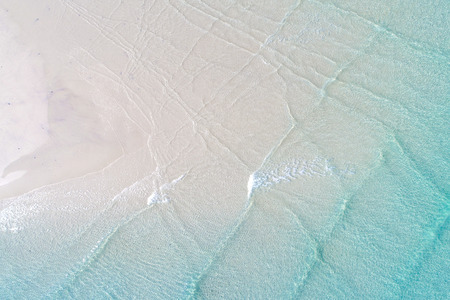 White sand beach nature background turquoise sea wave water aerial view vacation concept