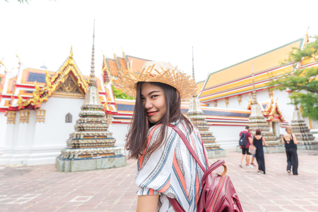 Asian beautiful women travel in buddha temple Wat Pho, Bangkok Thailandの写真素材