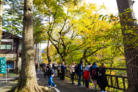 NIKKO, JAPAN-21 OCTOBER 2016: Asian tourist people enjoying to view colorful tree leaf and waterfall in autumn season.のeditorial素材