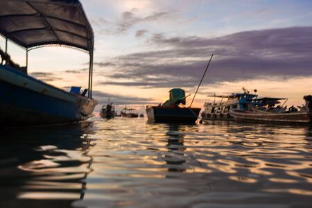 Silhouette sunset long tail boat colorful sky with cloud on beach at Koh Tao island, Thailand