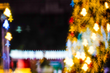 Blurred colorful light of christmas tree with bokeh winter holiday backgroundの写真素材