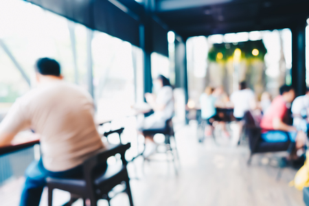 Blurred people working and recreation in modern cafe, Group of peopleの写真素材