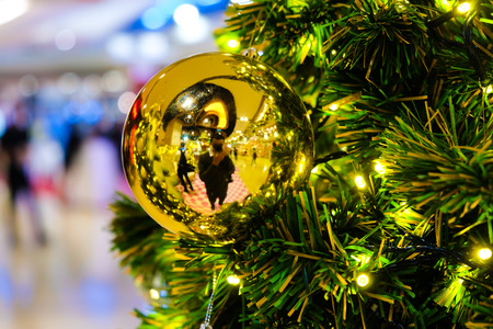 Colorful christmas tree with decoration object on pine treeの写真素材