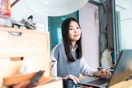 Entrepreneur business women working sale order at home workplace with laptopの写真素材