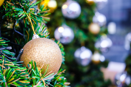 Colorful christmas tree with decoration object on pine treeの写真素材