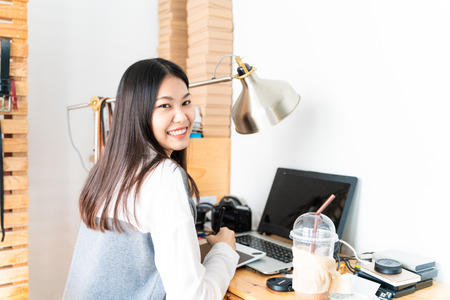 Smart business entrepreneurs asian women with online sale sme business owner in front of her home officeの写真素材