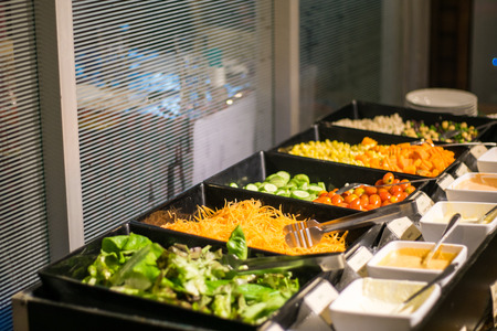 Colorful fresh salad bar healthy food in restaurant of hotelの写真素材