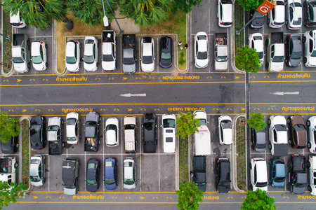 Aerial view many lot of car parking in row on concreteの写真素材