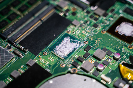 Abstract electronic circuit on computer mainboard close up technology conceptの写真素材