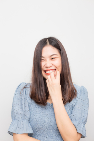 Smiling young asian beautiful women posting on white background, Wellness womenの写真素材
