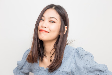 Smiling young asian beautiful women posting on white background, Wellness womenの写真素材