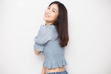 Smiling young asian beautiful women posting on white background, Wellness womenの写真素材