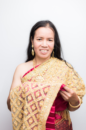 Beautiful asian aged women with Thai culture costume on white backgroundの写真素材