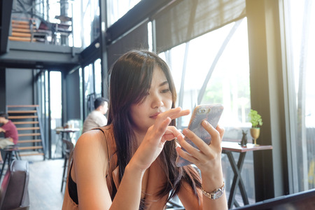 Happy young business women using smartphone in cafe, Business communication concept