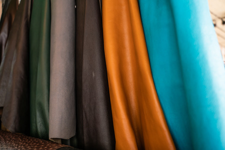 Tanned leather on shelf in craftsmanship market