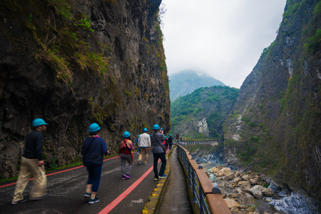 TAROKO NATIONAL PARK, TAIWAN - MARCH 22, 2015: Tourists enjoy walking along Swallow Grotto (Yanzikou) Trail at Taroko National Park, Taiwanのeditorial素材