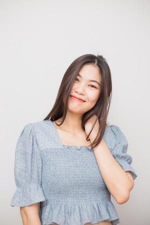 Portrait of beautiful asian long hair woman posting on white backgroundの写真素材