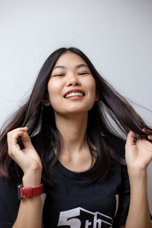 Joyful asian beautiful women smiling on white background, Long hair womenの写真素材