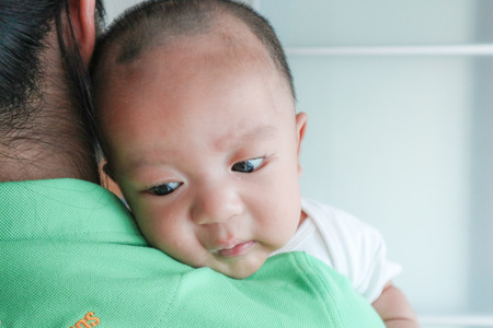 Mother holding her infant baby boy, Motherhood conceptの写真素材
