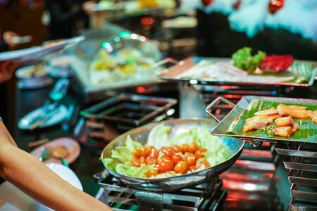 Hand of people take buffet food in hotel party, Food and drinkの写真素材