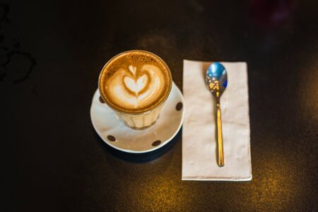 Hot latte art coffee in cup with copy spaceの写真素材