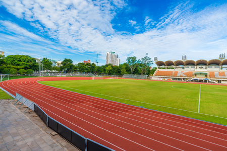 Football outdoor green grass field with stadiumのeditorial素材