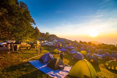 Tourist enjoying sunrise on mountain with camping, Nature landscape recreationのeditorial素材