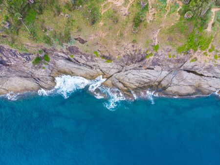 Tropical forest on sea island beach aerial viewの写真素材