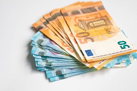 Pile bundle of euro bills money note on white background, Business financeの写真素材