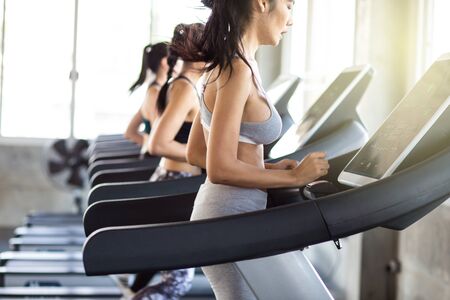 Group of running women on treadmill in fitness gym, Healthy conceptの写真素材
