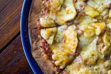 Homemade tasty pizza slim edge ready to eat on wood