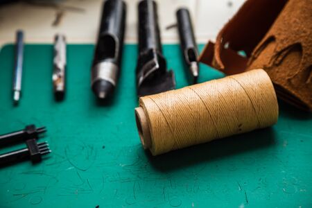 Leather craftsmanship working with tool, Hobby workの写真素材