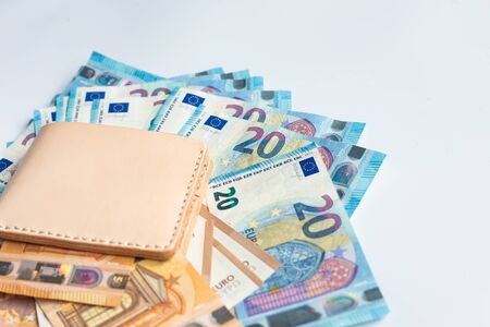 Leather wallet with euro money bill on white background financial conceptの写真素材