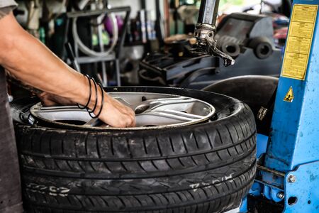 Tire fix shop with professional repair machine, Tire serviceの写真素材