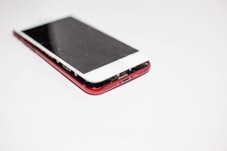Screen broken of smartphone on white background, Crashed cellphoneの写真素材