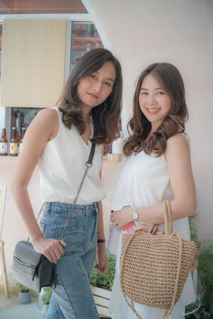 Happy young business asian women walking in city villa market outdoor fashion