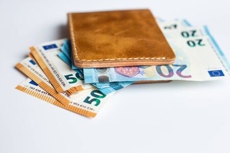 Euro money in leather wallet business finance on white backgroundの写真素材