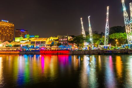 SINGAPORE - MARCH 5 : Colorful light building at night in Clarke Quay, Singapore on March 5, 2015. Clarke Quay, is a historical riverside quay in Singapore, located within the Singapore River Area.のeditorial素材