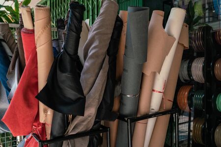 Raw genuine cowhide leather on shelf in craft shop DIY storeの写真素材