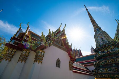 Buddhist pagoda temple sunshine day blue sky in Bangkok, Thailand