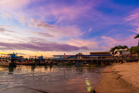 Silhouette sunset boat on sea beach colorful sky with cloud, Koh Tao Thailandのeditorial素材