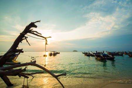 Sea beach morning sunrise colorful sky with boatのeditorial素材